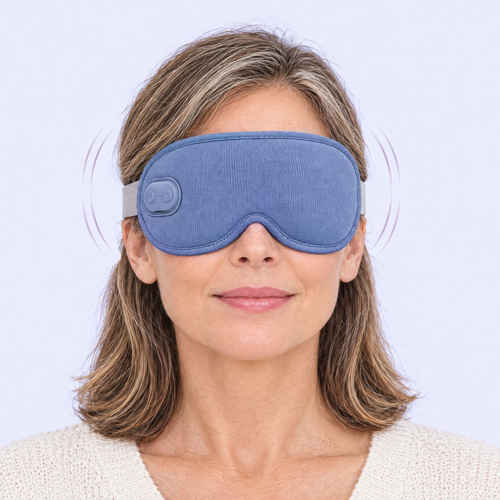 Woman wearing the Ocuelle mask using gentle massage mode
